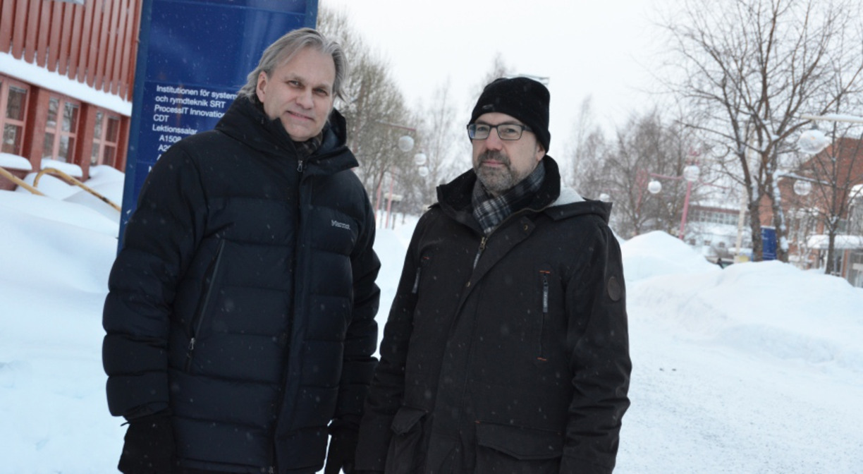 Michael Nilsson and Karl Andersson stand next to each other outdoors with snow in the background
