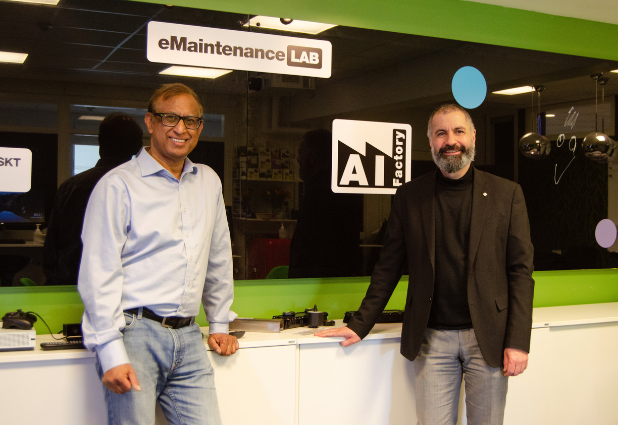 Uday Kamar and Ramin Karim standing in the lab AI Factory