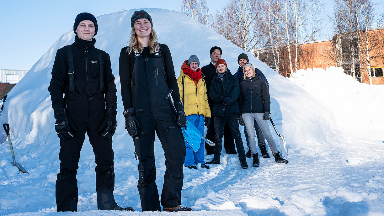 Students in front of an igloo